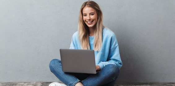 a woman, laptop, sitting