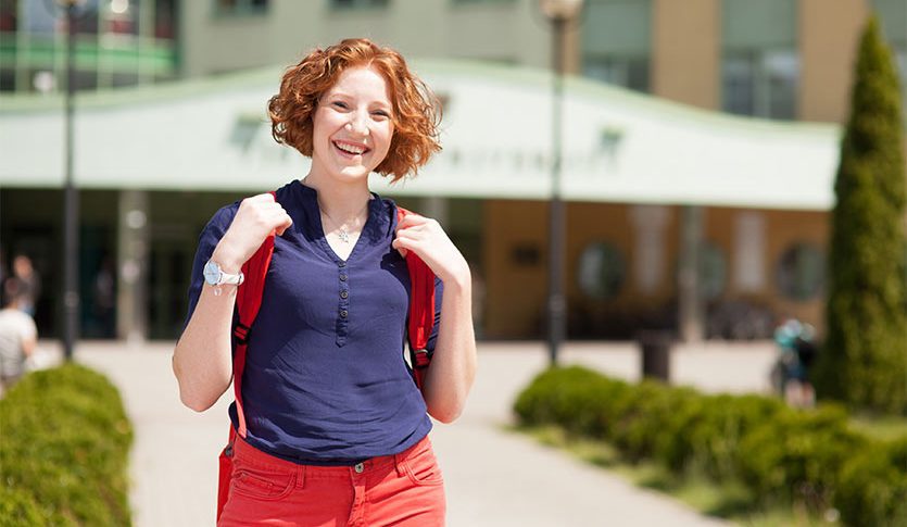 a woman, outside, Vistula, university, building