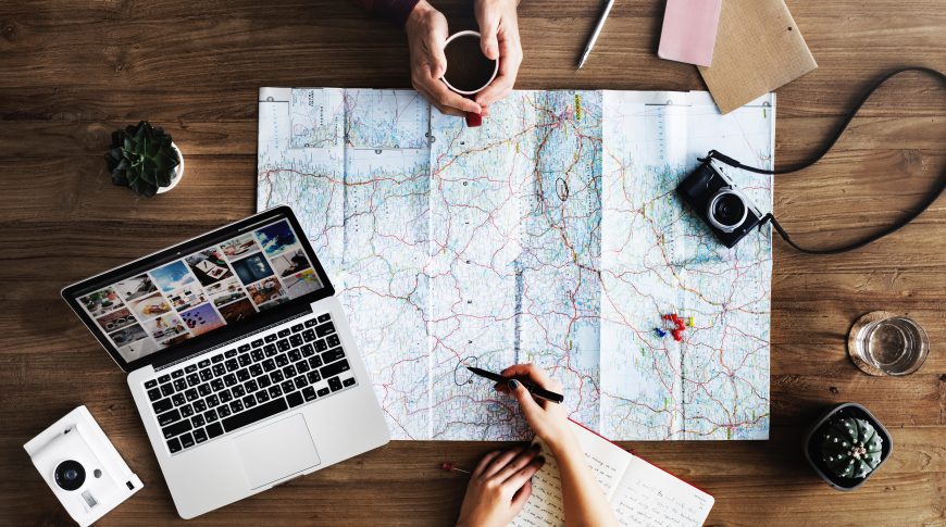 Map and laptop on the table
